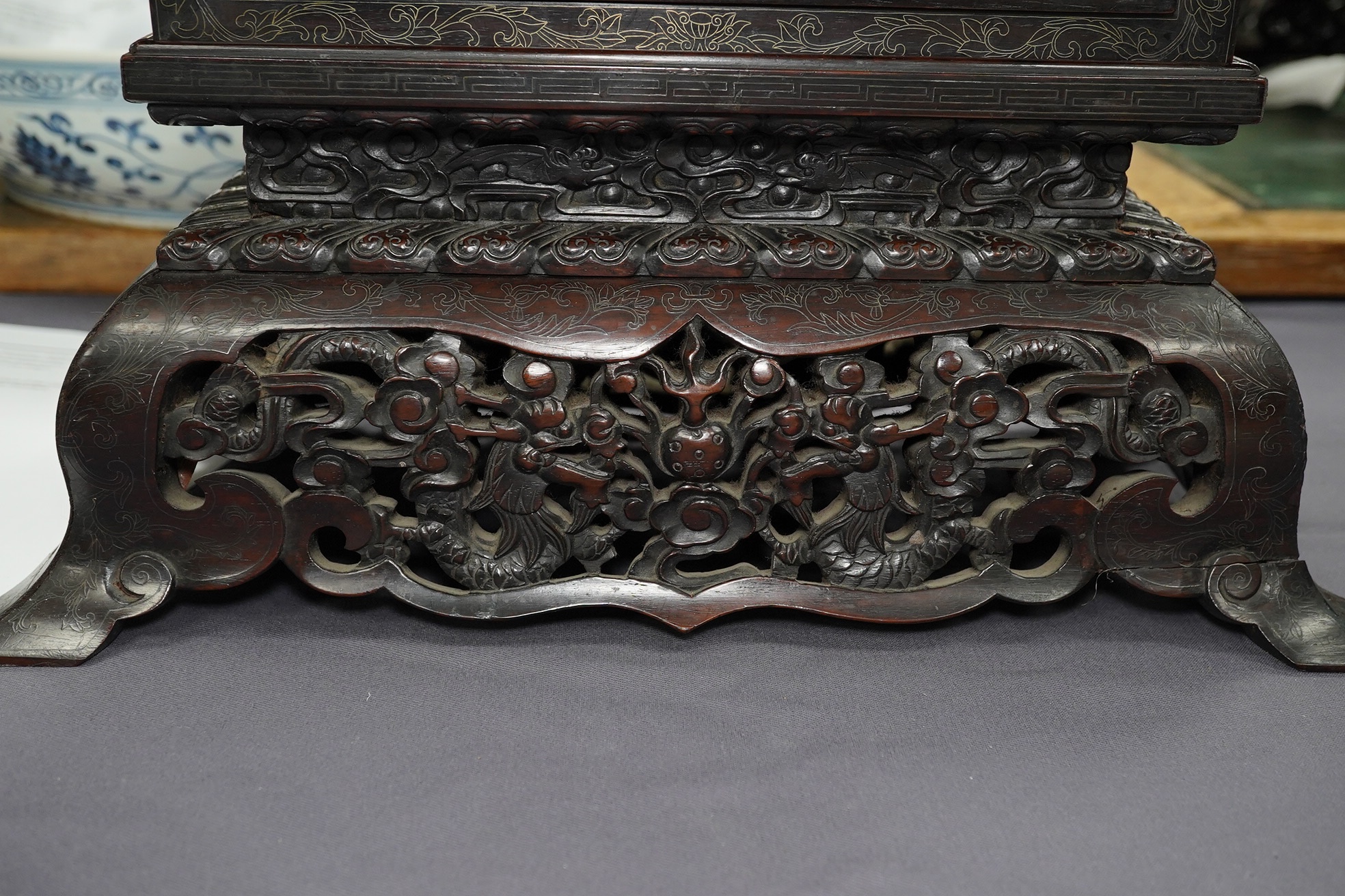 An important pair of Chinese carved zitan and silver wire inlaid ‘cloud and dragon’ curio cabinets and stands, duobaoge, probably Imperial, late Qing dynasty